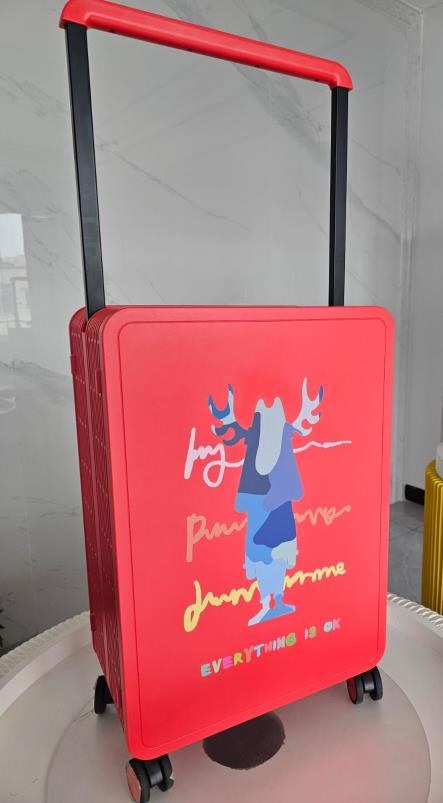 Red suitcase with full-colour brand campaign print