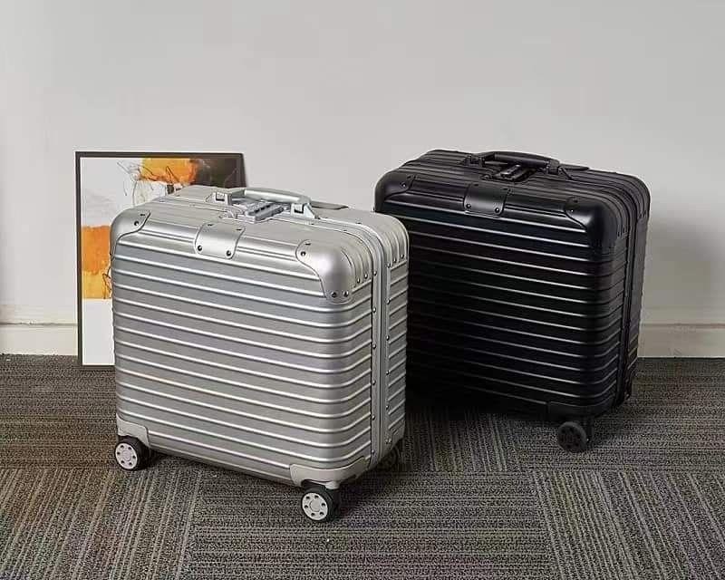 Silver and black aluminium-frame cabin luggage